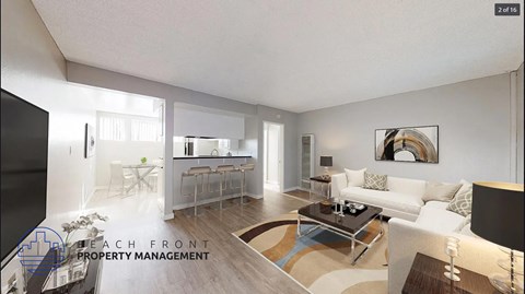 a living room with a couch and a table and a kitchen